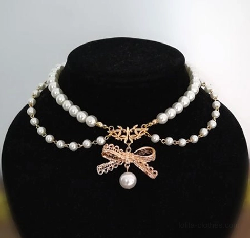 Upgraded version double-layer pearl bow lolita necklace close-up detail shot on black jewelry stand showing two rows of white pearl chains with spaced beads, golden bow charm with large hanging pearl pendant, kawaii lolita accessory