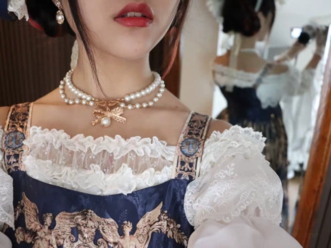 Upgraded pearl bow lolita necklace premium version spaced beads design detail macro photography showcasing individual pearl quality and golden bow charm enhancement, close-up jewelry craftsmanship