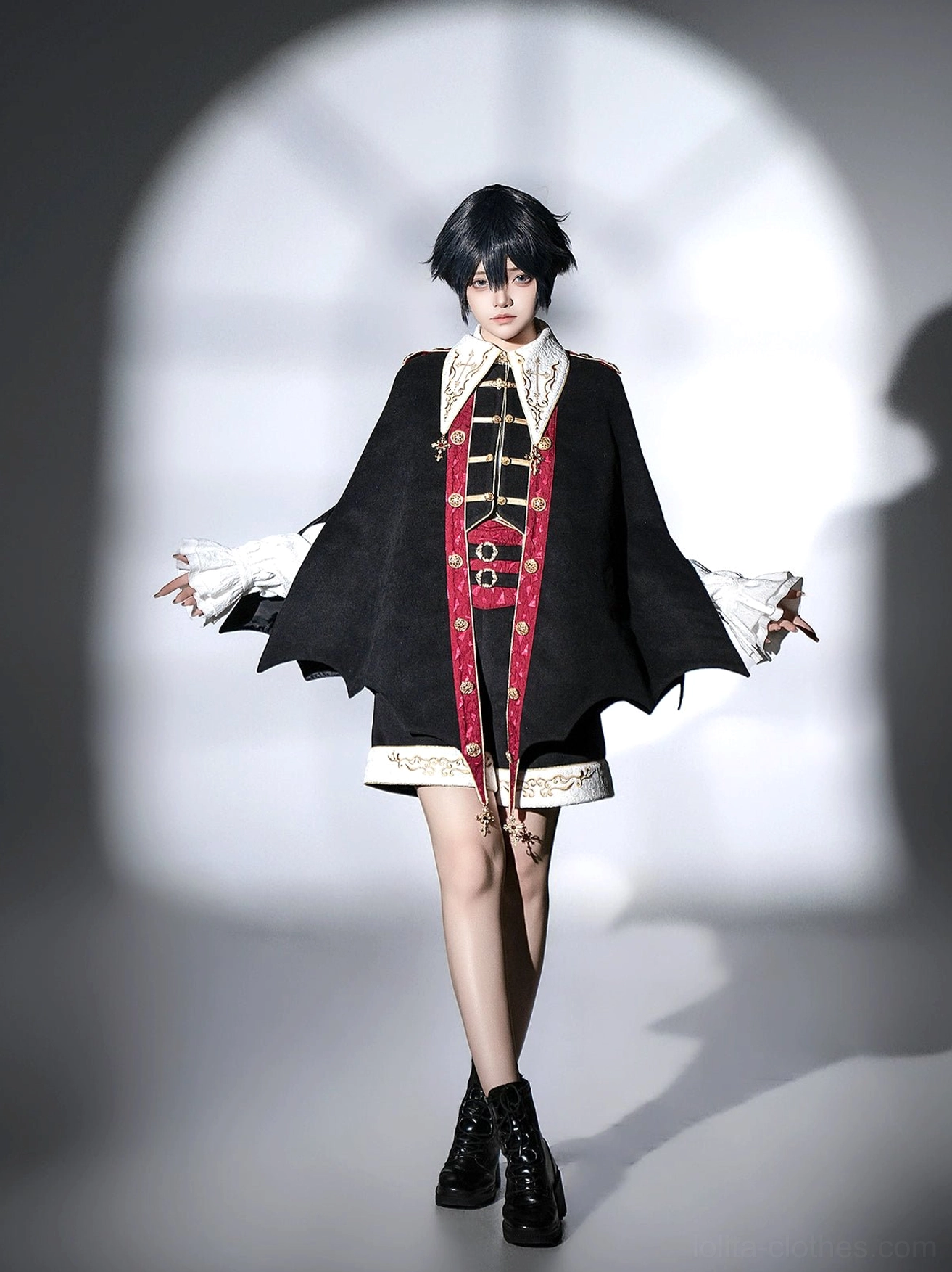 Back view of model wearing vampire Ouji Lolita bat cape set with open-arm pose showcasing clean solid black bat-shaped cape back