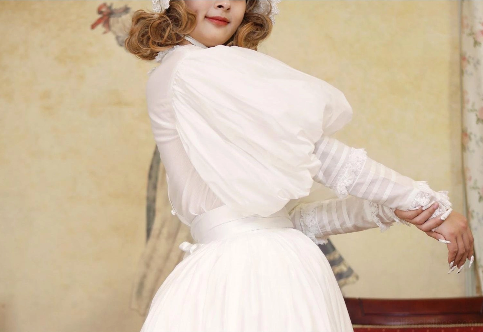 Victorian Lolita blouse waistline construction showing fitted waist placement, pleating detail, and transition to high-waisted skirt silhouette characteristic of period-inspired design