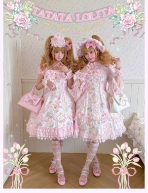 Pair of blonde twin models in sweet lolita fashion featuring floral print one-piece dresses with off-shoulder necklines, layered ruffled skirts, matching handbags and flower hair accessories against TATATA LOLITA backdrop