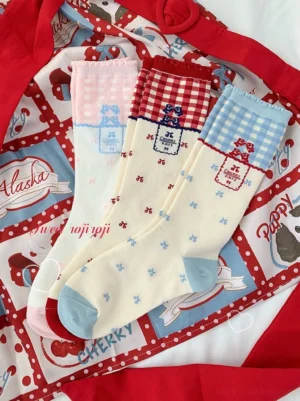 Roji Roji vintage gingham lolita mid-calf socks three-color variants overhead flat lay display with red blue and pink gingham cuffs bow dot prints on cream off-white base fabric retro tags