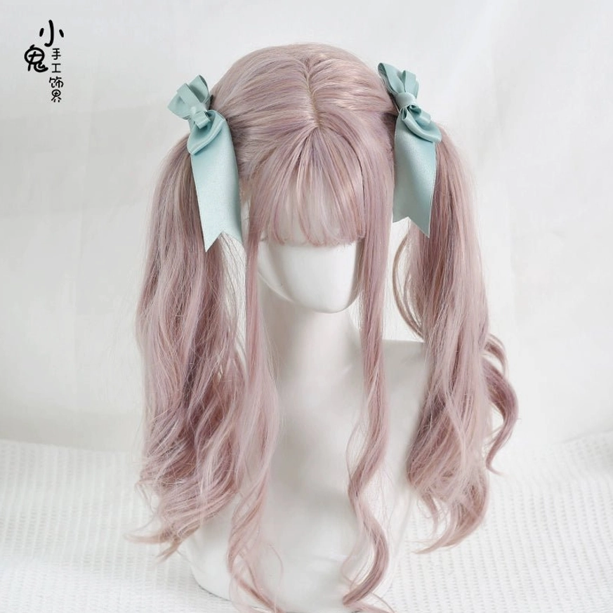 Vintage-inspired satin bow hair clip demonstrating Victorian rococo aesthetic central to lolita fashion culture