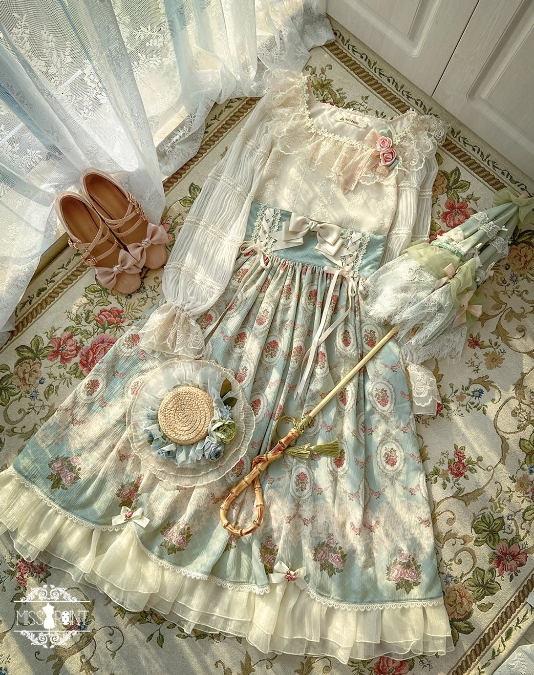 Flat lay overhead view of complete vintage Lolita blouse coordinate with accessories and matching items on floral carpet