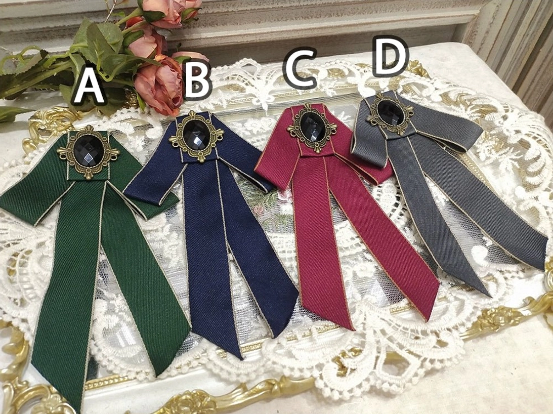 lolita-four-piece-bow-brooch-set-green-navy-wine-red-dark-gray-vintage-oval-gemstone-bronze-frame-white-lace-placemat-gilt-edge-rose-decorations