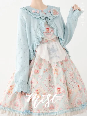 Baby blue vintage Lolita cropped knitted cardigan with ruffled trims and hollow-out knit texture worn on mannequin styled with sweet Lolita floral skirt
