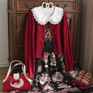 Burgundy vintage Lolita knitted cardigan with ruffled doll collar and lace trim worn over tea party themed JSK dress with matching red handbag and strap shoes