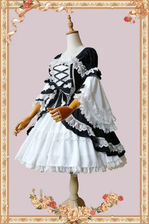 Doll-like vintage lolita one-piece dress with layered flounce sleeves and all-over lace trims, shown from three-quarter side view on wooden dress mannequin with vintage floral backdrop, displaying crisscross front design and ruffled hem