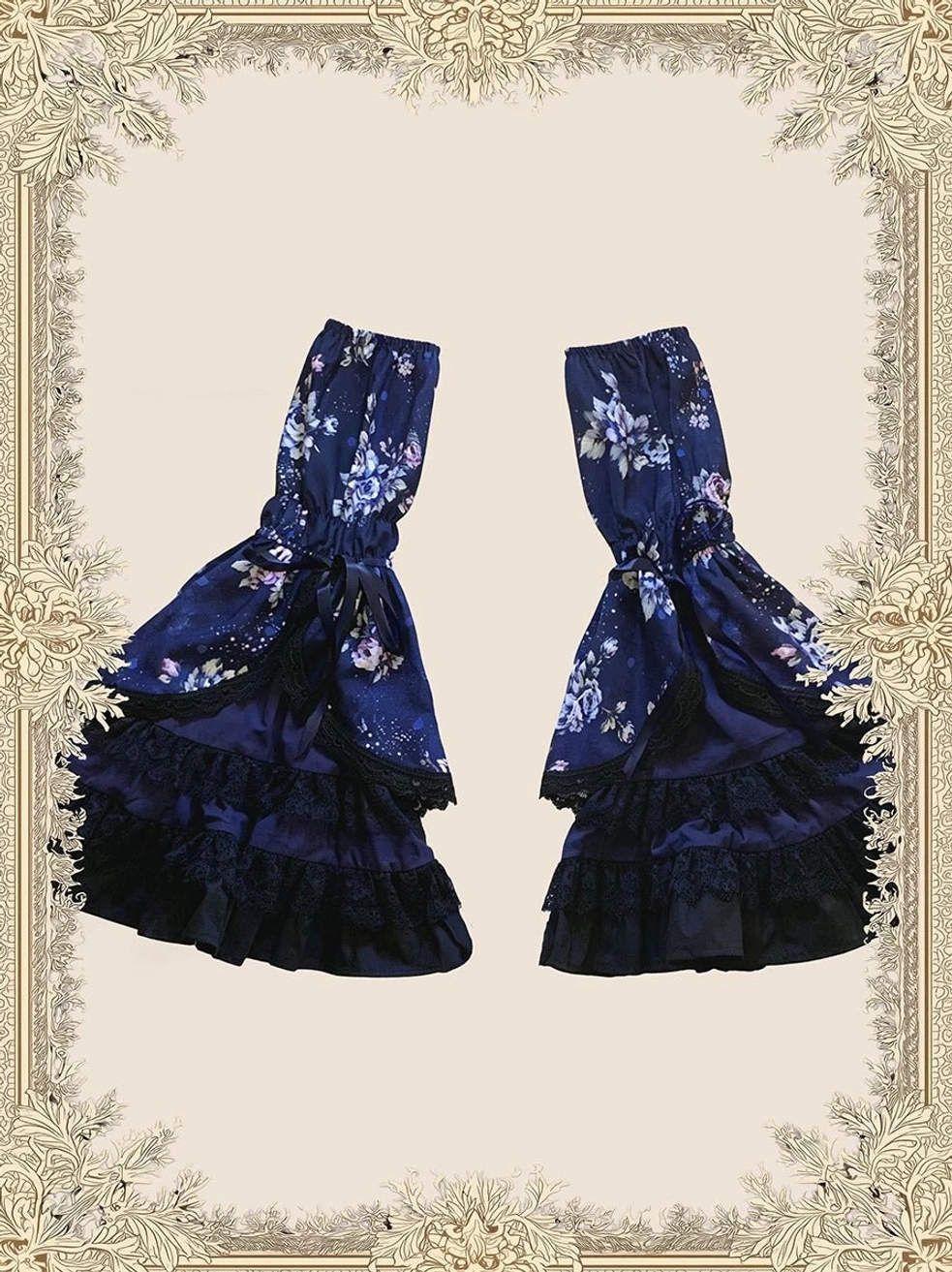 Vintage lolita aesthetic styling featuring floral print old school OP dress worn with complete coordinating accessories bonnet arm cuffs and jewelry in classic tea party scene