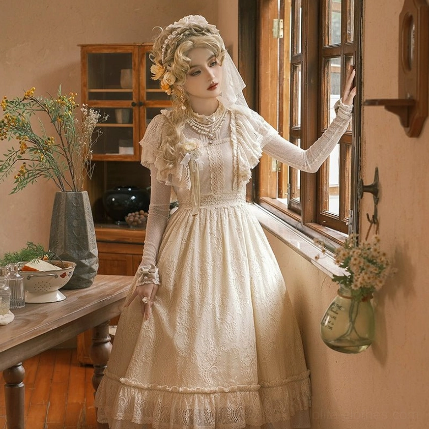 Champagne vintage Lolita OP dress half-body side view by indoor window, model near vintage wooden cabinet, full lace bodice with sheer long sleeves and lace-trimmed skirt hem