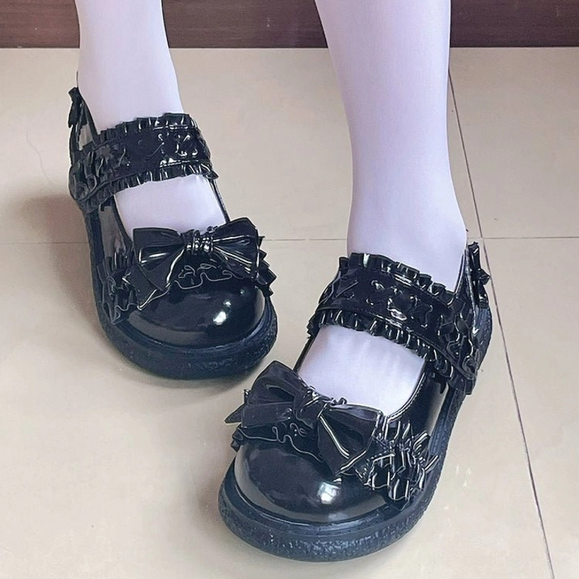 Vintage-inspired styling of Lolita flat shoes with classic Victorian aesthetic elements, paired with coordinating sweet Lolita accessories and tea party styling