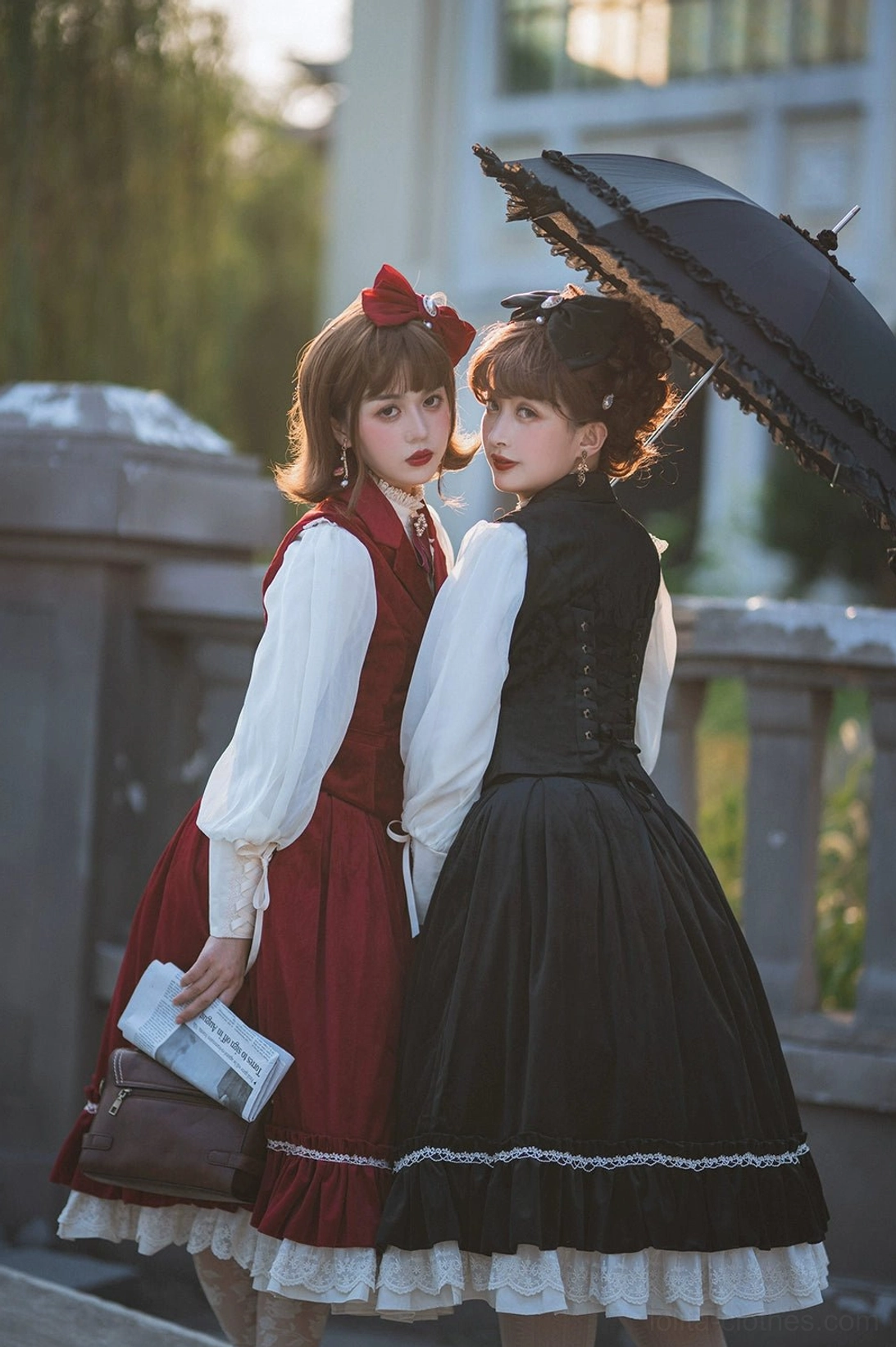 Lolita girls wearing velvet waistcoat sets with corset back design and white lace skirt trim, side view full shot