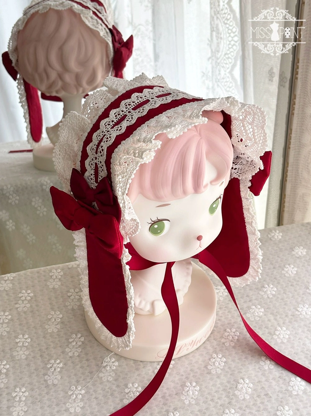 Vintage cat-ear Lolita bonnet headdress with white lace red velvet ribbon trims ruffled edge and long tie straps close-up display