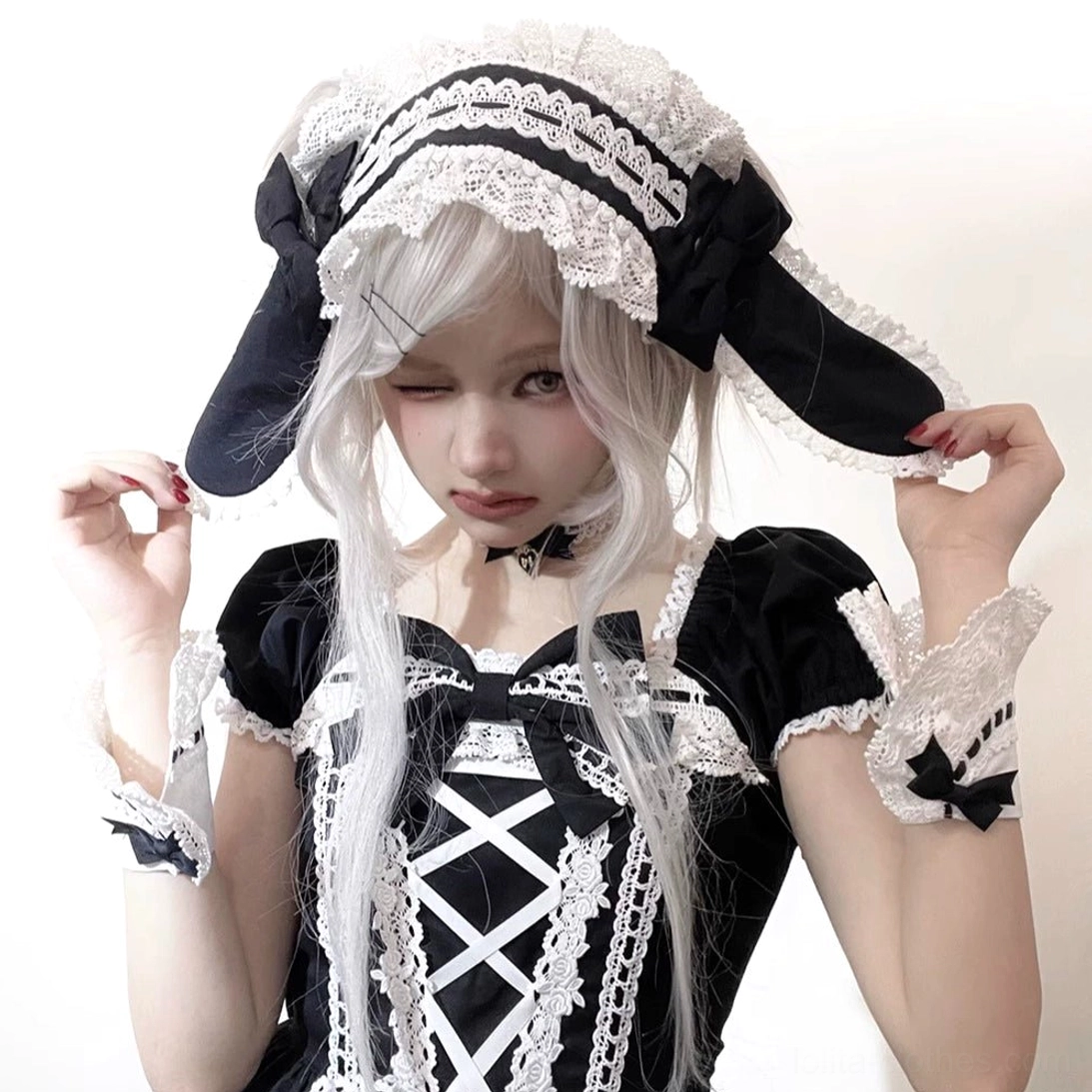 Black and white maid-style Old School Gothic Lolita outfit with vintage petal rabbit bunny ear headdress and detachable lace wrist cuffs