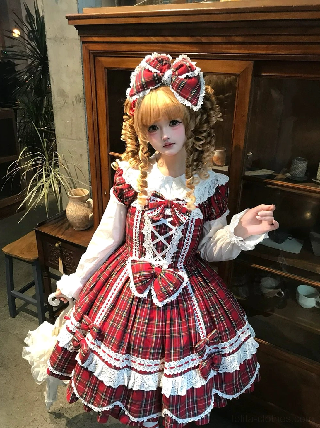 Vintage plaid lolita one-piece dress waistline detail showing pearl-adorned bow decoration and refined embellishment placement