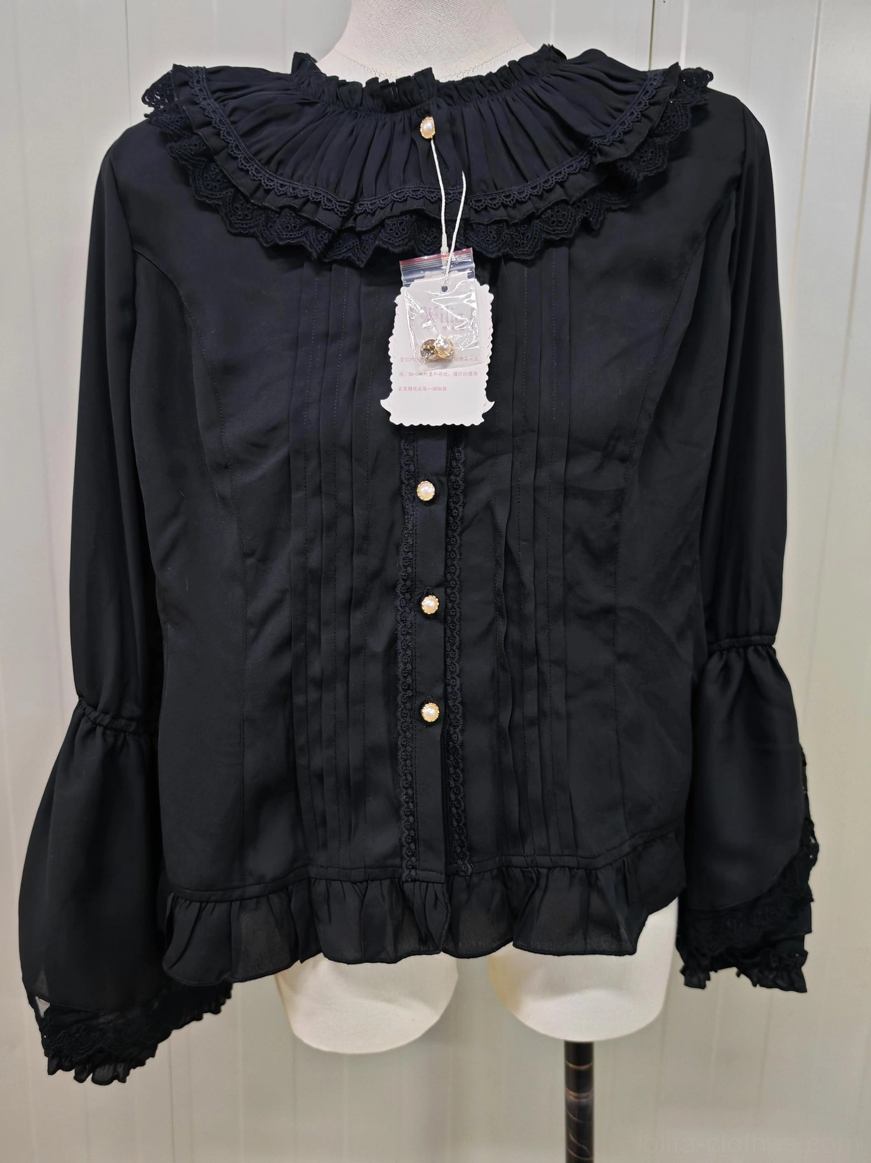 Black retro princess long sleeve lolita blouse with ruffled lace neckline gold-toned front buttons vertical bodice pleats flared ruffled cuffs