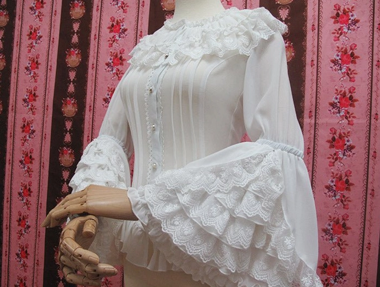 White vintage princess lolita blouse three-quarter front view with unique hand posing ruffled lace collar front pearl buttons