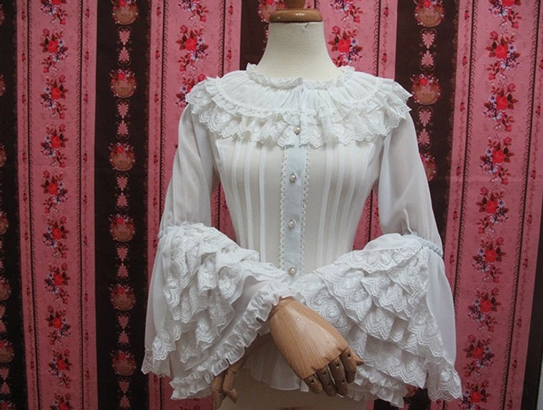 White vintage lolita blouse with tiered lace flared cuffs pleated bodice and round neck ruffled lace trim front display