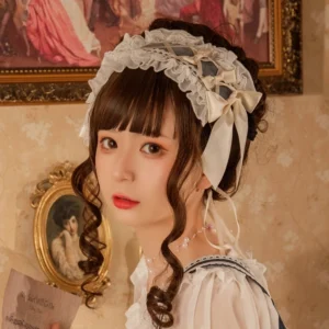 Sweet vintage ruffled lolita headband with cream white lace frill trim and elegant satin bow accent worn by model in retro sweet blouse, perfect for classic lolita styling