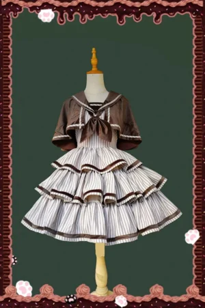 Front display of brown and white striped Lolita JSK with sailor collar and detachable cape shown on dress form without model, showcasing layered ruffled cake skirt design with brown trims and structured sailor aesthetic