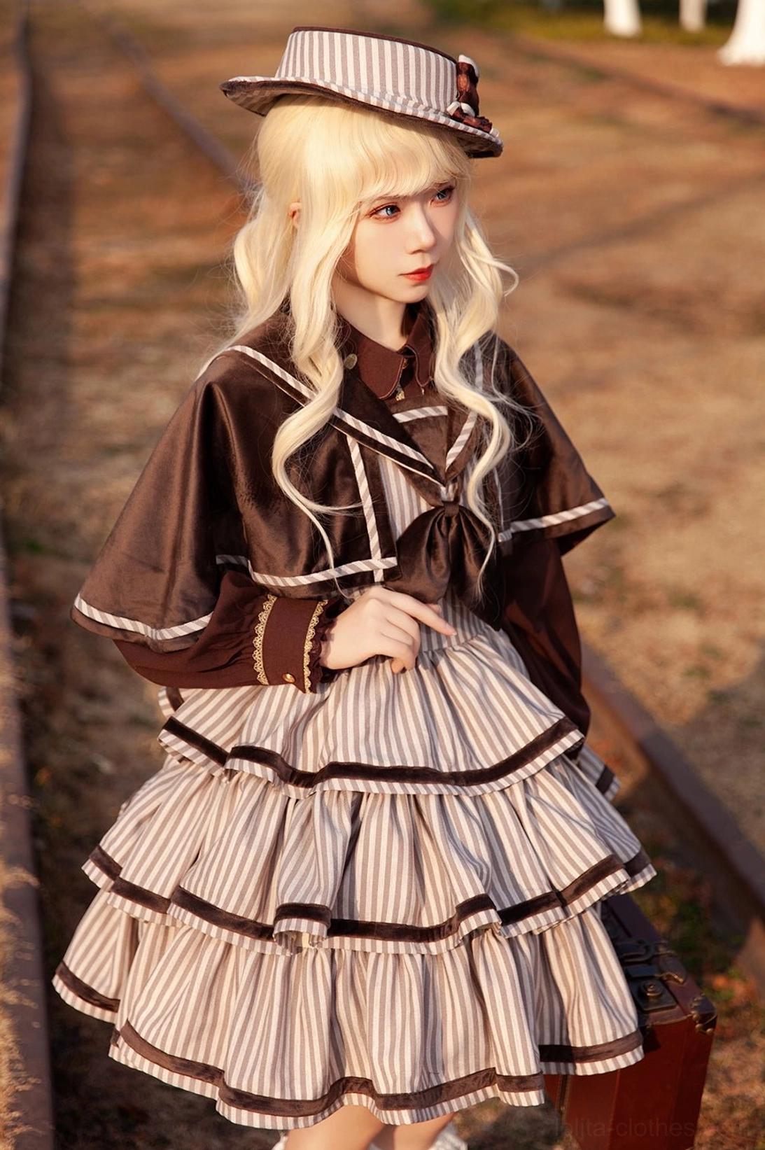 Detailed view of vintage striped peppy sailor Lolita JSK showcasing sailor collar construction, detachable bow tie, structured bodice, and side zipper closure on dress form display