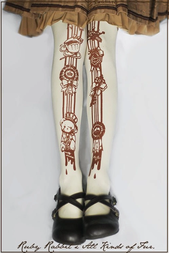 Ivory vintage teddy bear tea party print 120D velvet Lolita tights on wearer with brown ruffled Lolita skirt and black Mary Jane shoes, showing full leg coverage with cream base and reddish-brown decorative motifs including teddy bears teacups badges and ribbon designs