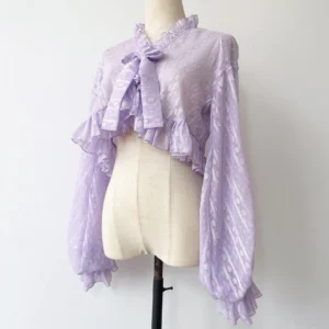 Light purple violet dotted jacquard chiffon Lolita cropped cardigan with ruffled collar and large bow displayed on dress form