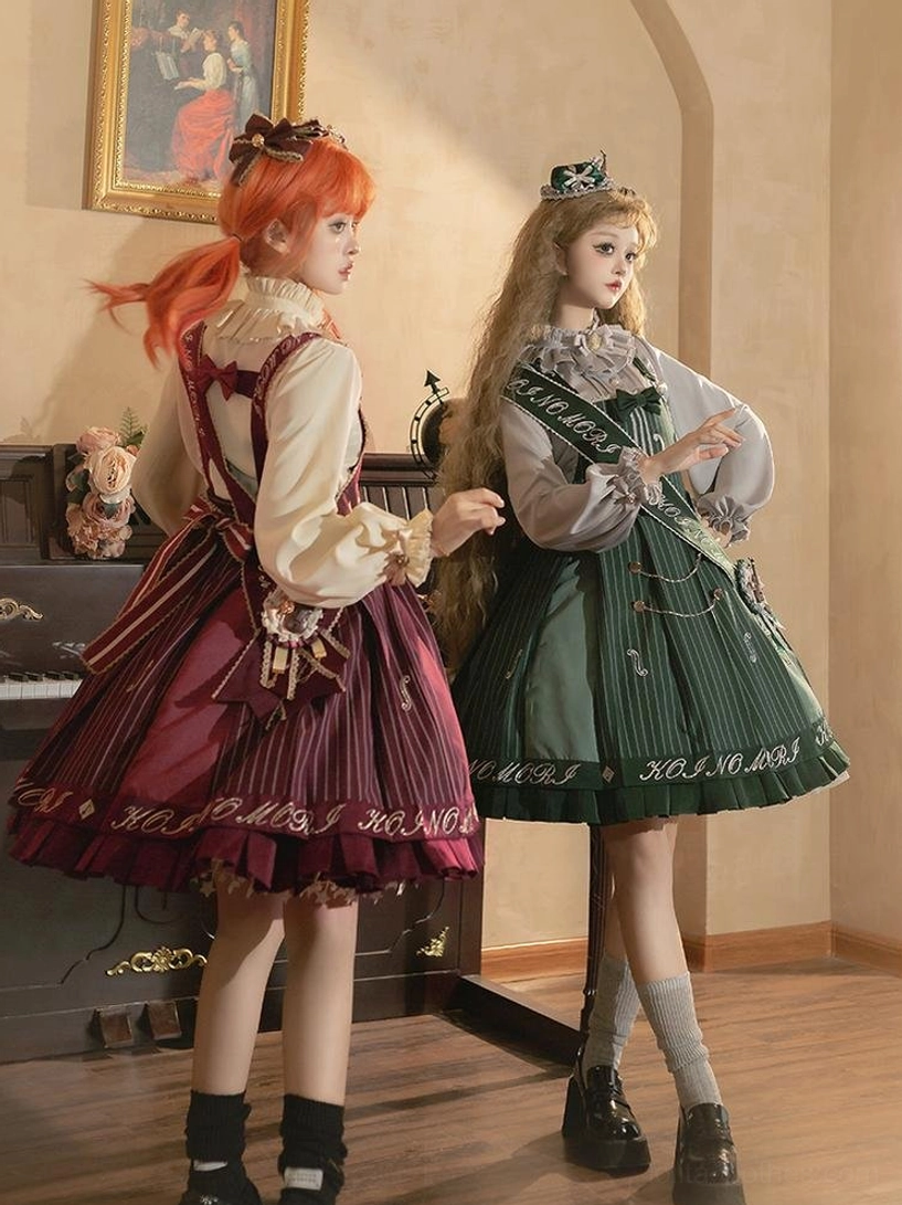 Vintage indoor room side back view of two female models in violin themed preppy Lolita salopette sets with puff sleeve blouses ruffled collars and crown hair ornaments