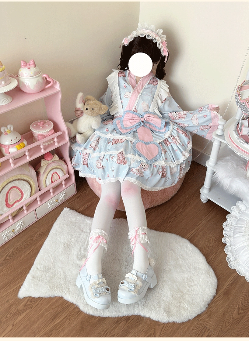 Plus-size wa lolita coordinate side view seated on fur rug, displaying wide flared kimono sleeves, ankle socks with lace trim matching skirt ruffles, and decorative frilled hair headband
