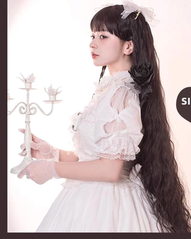 Model wearing black waltz lolita long curly wig left side view white lace dress