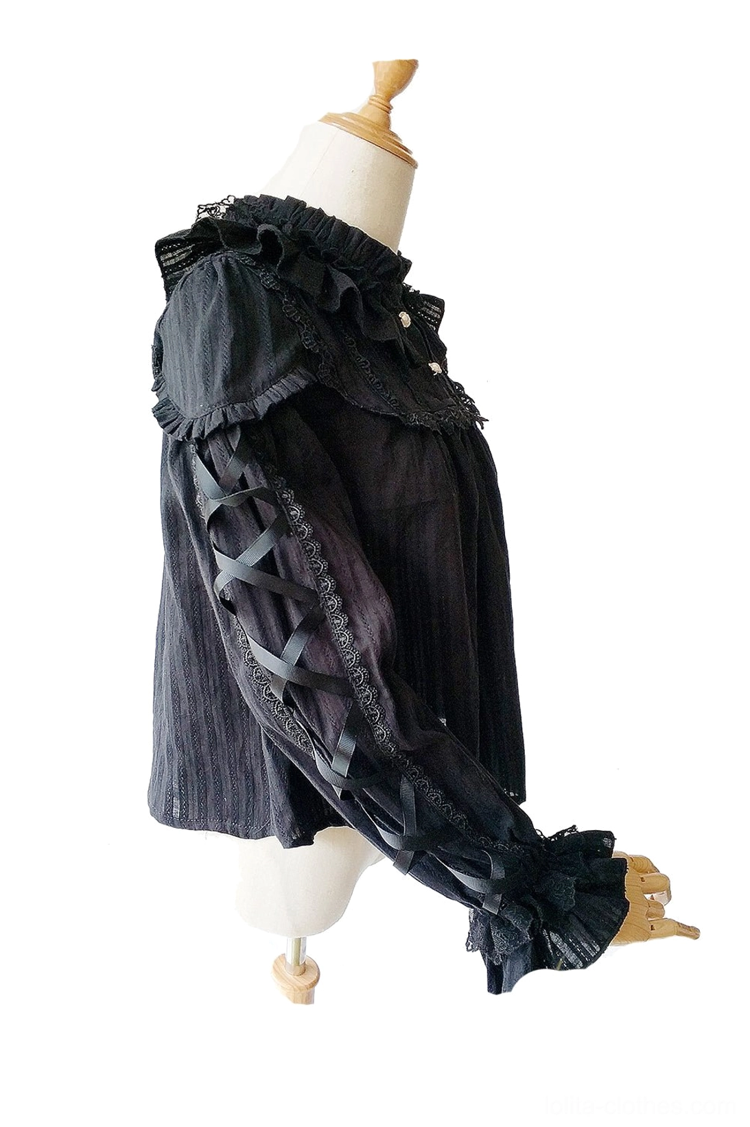 Warm Tea black gothic ribbon cross lolita blouse three-quarter view with crisscross ribbon straps ruffled collar and pearl buttons