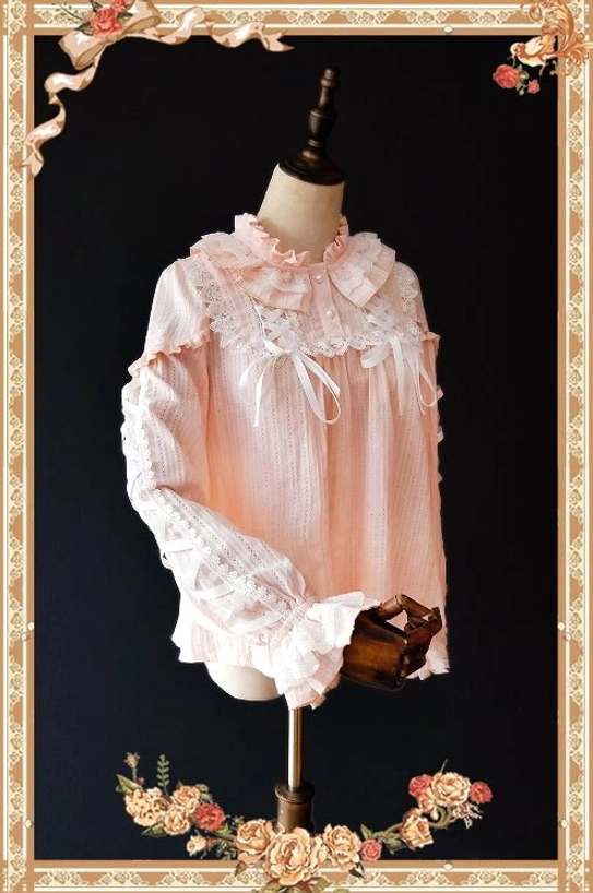 Warm Tea soft pink cotton lolita blouse three-quarter side view with peter pan collar lace sleeve decorations and flared cuffs