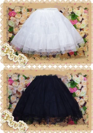 Pure white three-layer A-line Lolita petticoat with delicate lace hem trim displayed on flat surface against romantic floral background, showcasing soft tulle construction and elegant volume