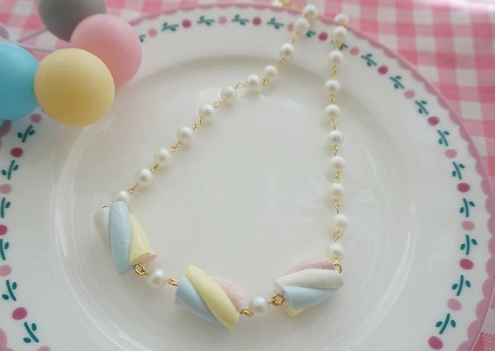 White and blue sweet lolita cotton candy necklace with sky blue and pearl white simulated marshmallow charms, gold-tone metal chain, imitation pearls, and adjustable extension for versatile styling