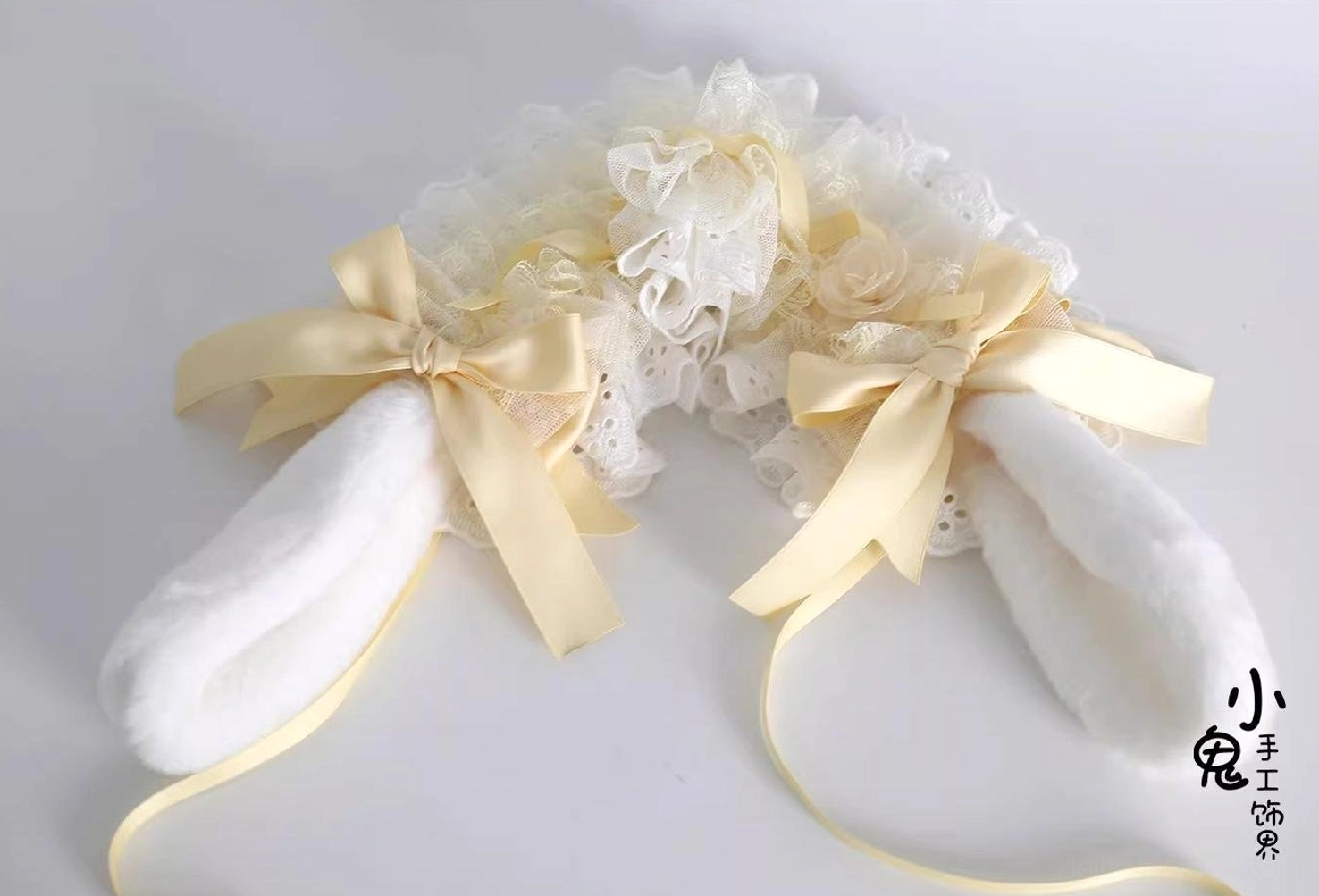 white-bunny-ear-lace-lolita-hairband-accessories-close-up-eyelet-lace-quality-beige-satin-bow-details