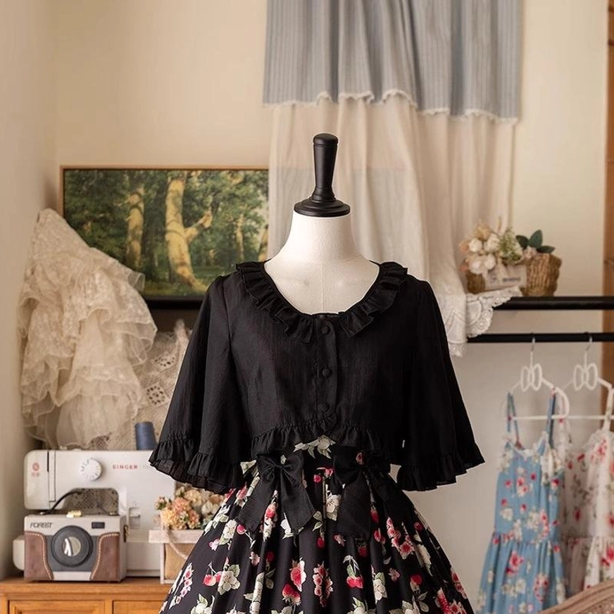 Ruffled cropped Tencel cardigan in white displayed on dress form with Lolita outfit coordinate, showing versatile layering capability and elegant proportion for sweet and classic styles