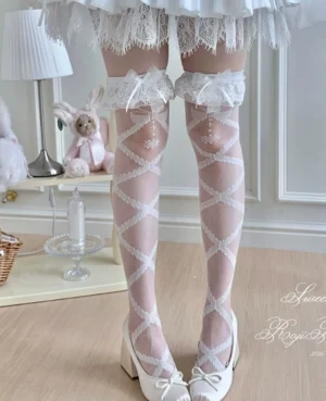 White celestial cross-print lolita thigh-high socks with ruffled lace cuff, sheer tulle fabric, worn with white platform Mary Jane shoes in cute bedroom setting