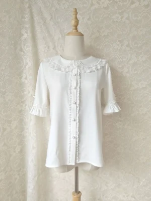 White chiffon lolita blouse with lace-trimmed peter pan collar and ruffled half sleeves featuring detachable white bow accents and delicate lace front placket with round buttons front view