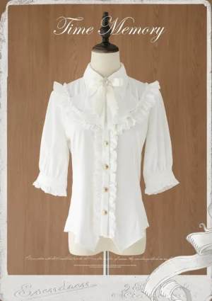 White classic lolita chiffon blouse with jabot ruffle and mutton sleeves front flat lay display on dress mannequin vintage studio