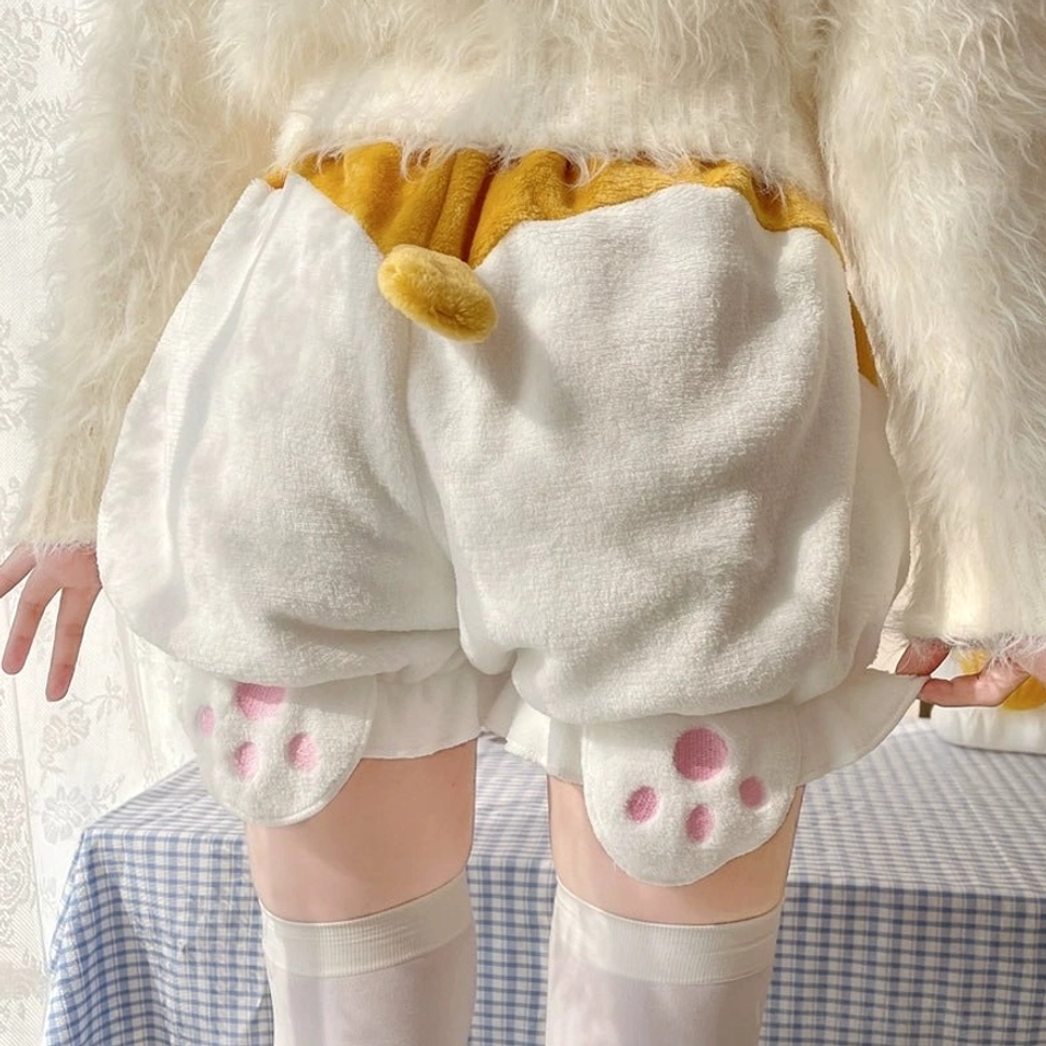 Detailed product photography of white velvet corgi-tail Lolita bloomers showing tail placement fluffy texture ruffled cuff details and construction