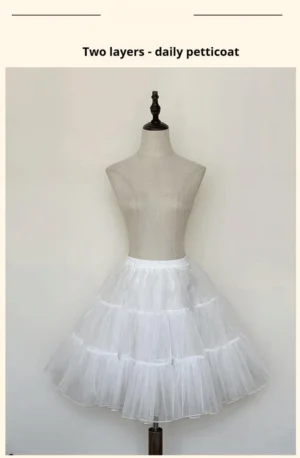 White two-layer daily lolita petticoat indoor studio front view on dress form showcasing neat compact tiered tulle ruffles and refined puff shape