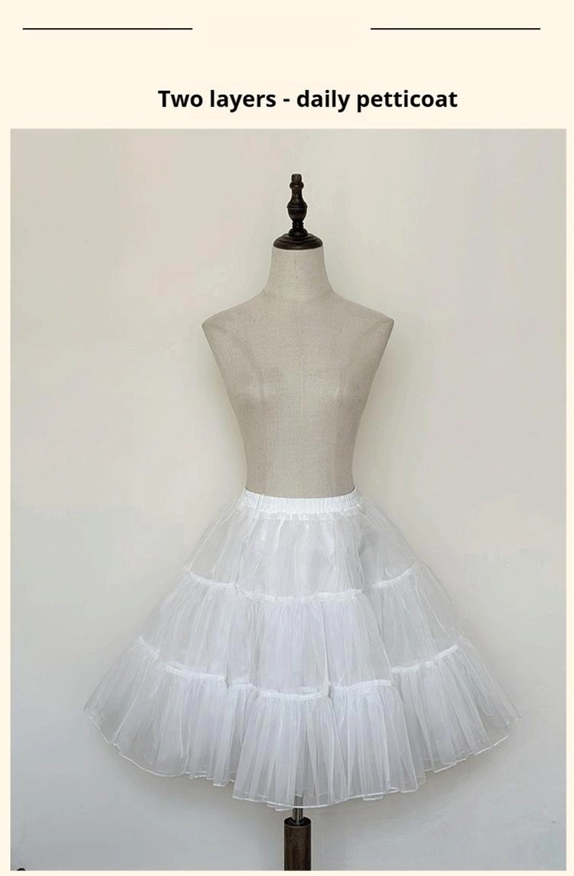 White two-layer daily lolita petticoat indoor studio front view on dress form showcasing neat compact tiered tulle ruffles and refined puff shape