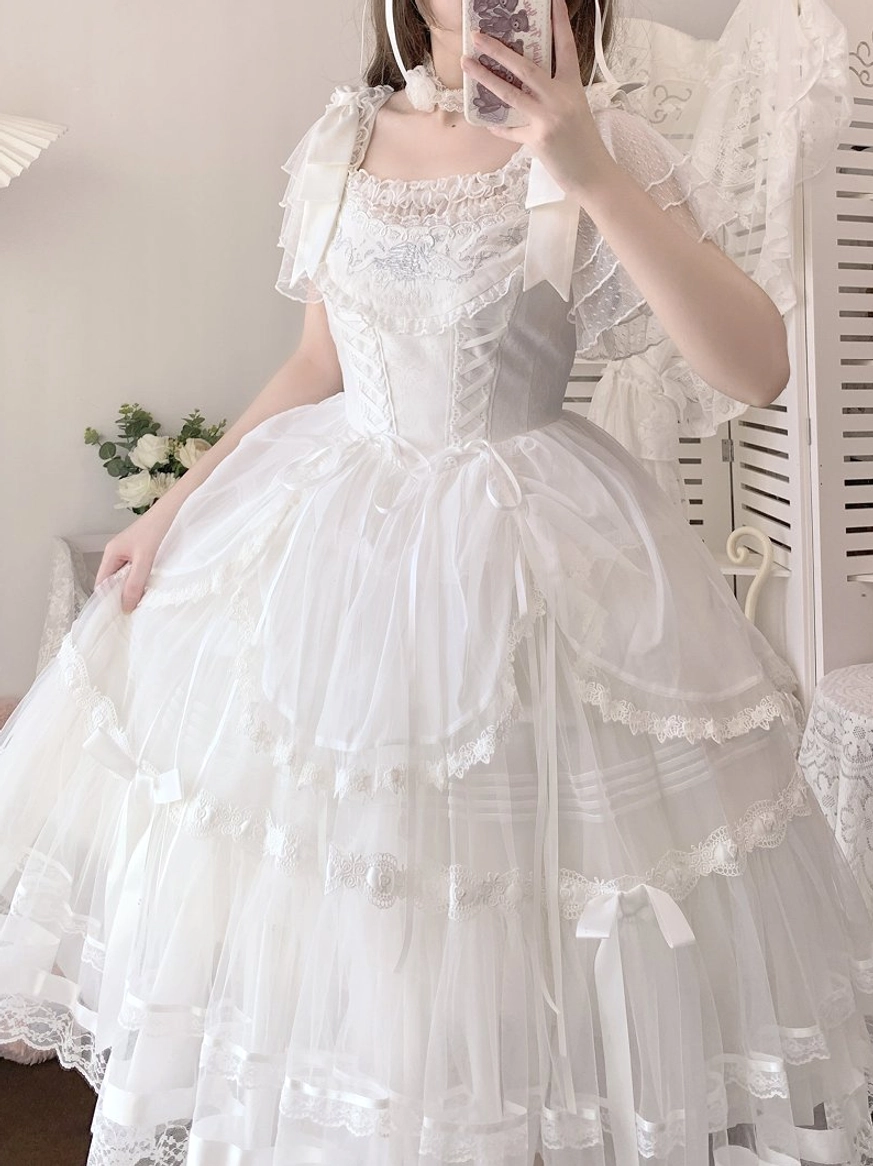 White elegant Lolita blouse with square neckline and layered tulle skirt, full three-quarter front view on model