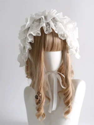 White embroidered lace lolita hairband front three-quarter view showing delicate ruffled eyelet lace trim and elegant bow design on blonde curly wig