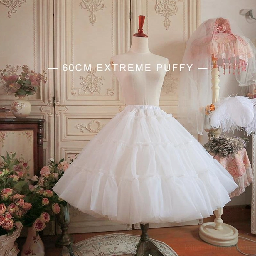 White extreme fluffy A-line petticoat 60cm front three-quarter view on dress mannequin, showing four-layer organza construction and volume, vintage floral studio setting