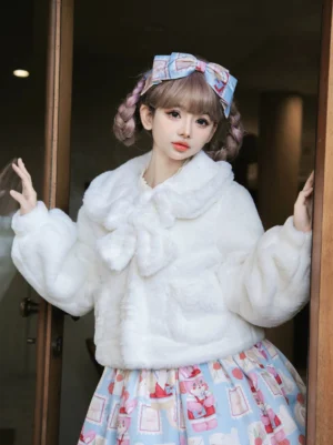 White faux fur lolita winter coat with doll collar and plush bow accent, front half-body view on model wearing vintage indoor doorway setting with matching hair bow