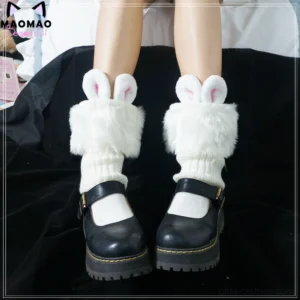 White fluffy rabbit ear lolita leg warmers overhead view paired with black Mary Jane shoes and white short socks showcase twisted knit fabric and 3D bunny ear decorations