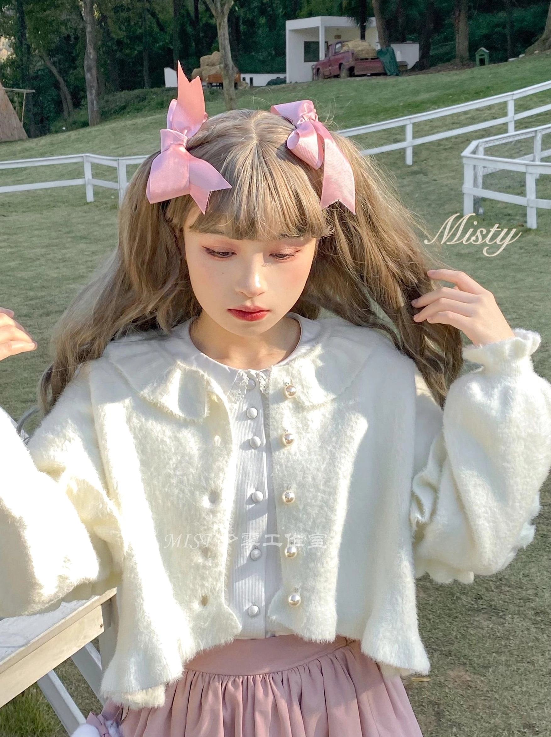 White fuzzy sweet lolita cropped cardigan doll collar puff sleeves pearl front buttons outdoor pasture scene half-body close-up detail shot