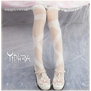 White opaque glass yarn lolita thigh stockings featuring crisscross strap design matched with pink lace-trimmed lolita skirt and pink bow shoes