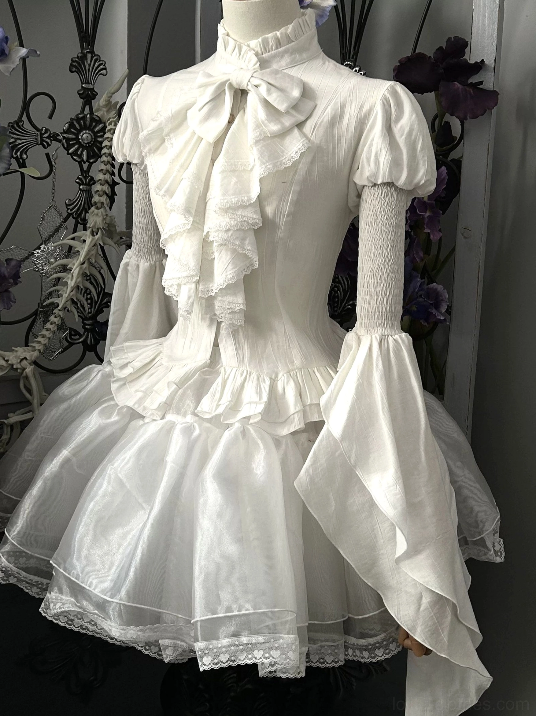 White Gothic Lolita blouse with detachable bell sleeves front full view dress form stand collar ruffled bow organza lace trim layered hem